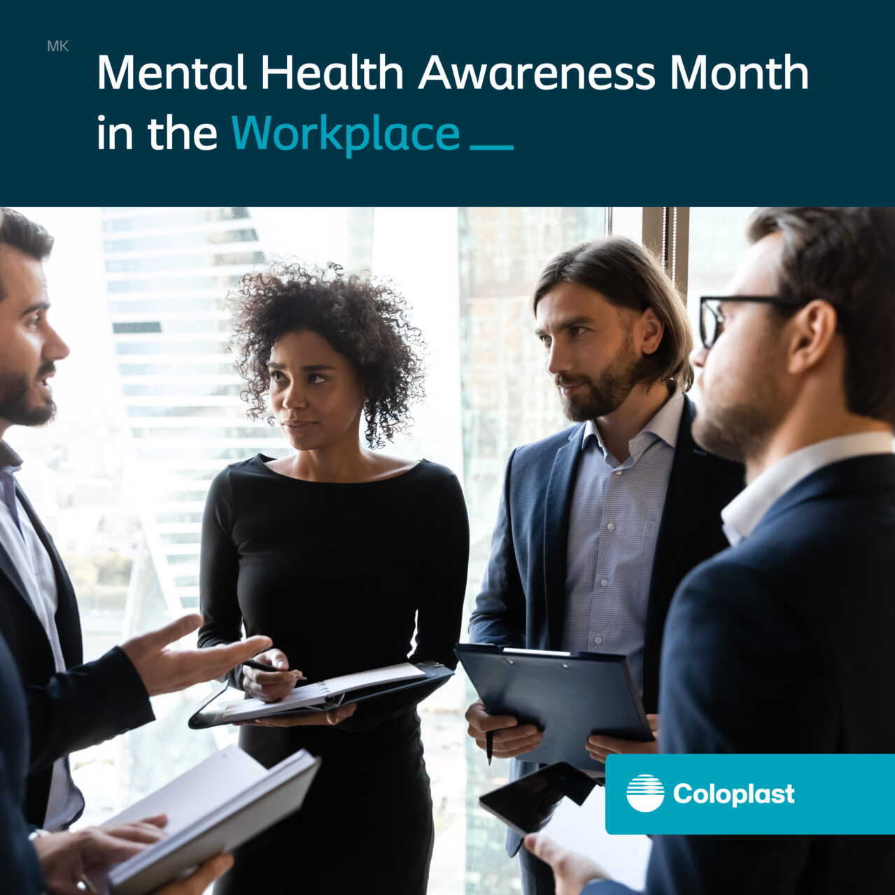 A group of four young professionals in the workplace having a conversation. Text on the image says 